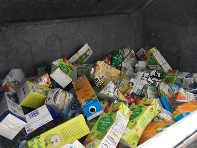 Image of tetra pak style cartons in a recycling skip
