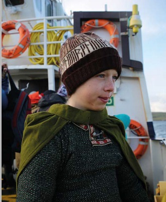 Young boy on board a boat.