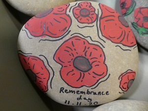 Remembrance stone painted with large poppies.