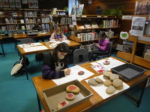 Painting Remembrance stones in Stromness.