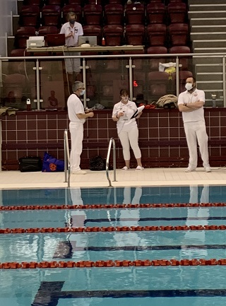 Derek Allan timekeeping at the swimming pool.