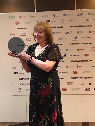 Maureen receiving lifetime achievement award in Glasgow.
