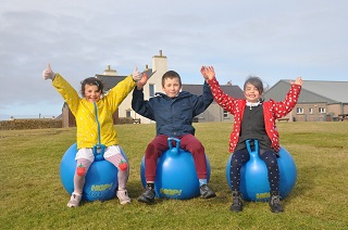 North Ronaldsay Community School reopens - its 3 pupils playing.