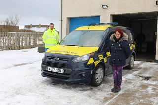 Coastguard Station Officer Mark Rendall with home carer Janette Mackie - Picture by Orkney Photographic