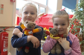 Two girls with Teddy Bears.