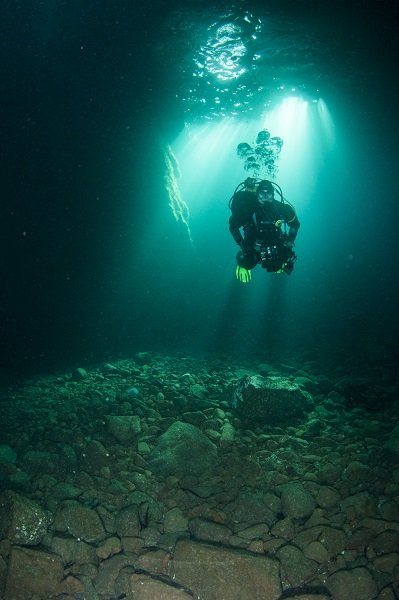 A diver exploring underwater caves. Image by Richard Shucksmith.