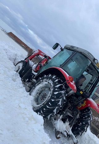 The tractor which transported Kayleigh in the snow.