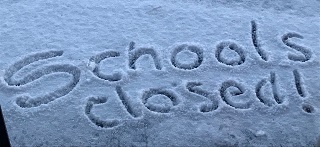 'Schools Closed' written in the snow.