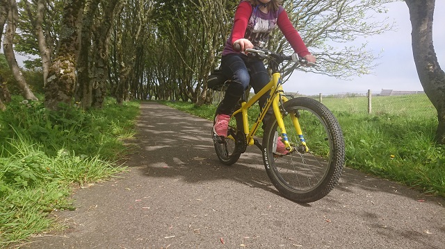 Image of young person on a bike at the Peedie Sea paths.