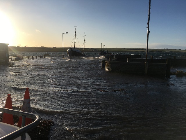 Burray Pier and adjacent road underwater in January 202