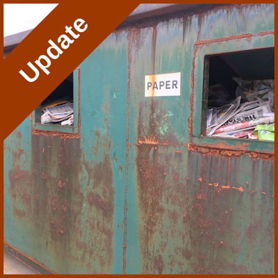 Graphic - a recycling skip with text 'update' overlaid
