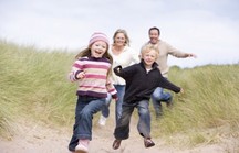 Image of children playing on a beach.