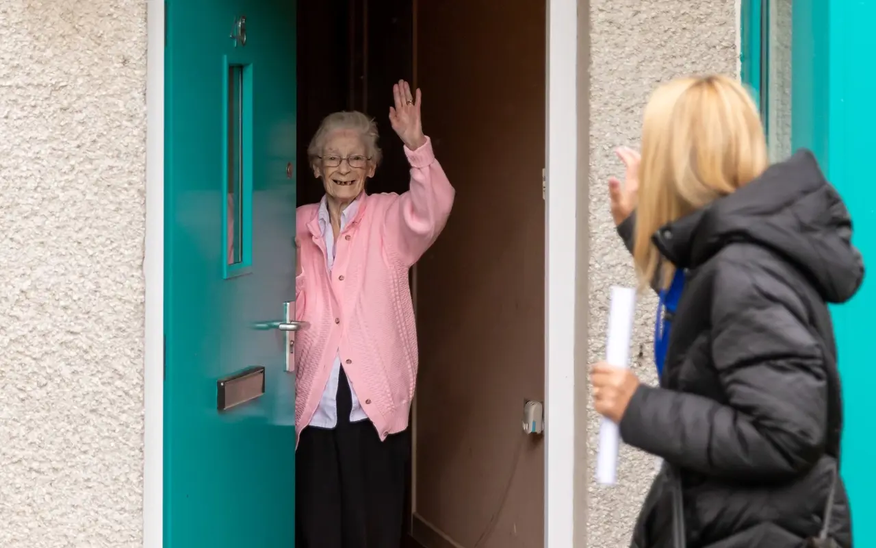 Colleague Visiting Customer At Home