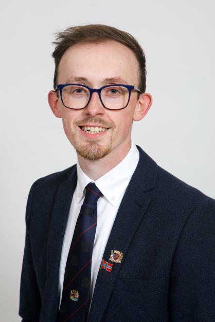 A portrait of Councillor Kristopher Leask.