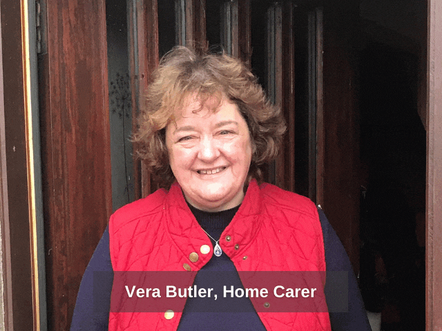 A photo of a lady smiling in a red gillet