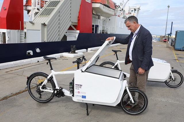 a man looking at an electric bike