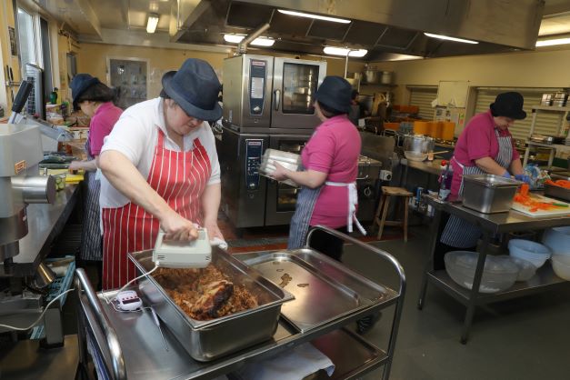 a lady preparing school lunches
