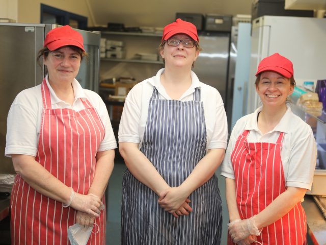 3 cooks in a school in their uniform