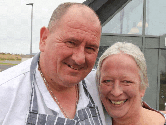 a man and a lady smiling