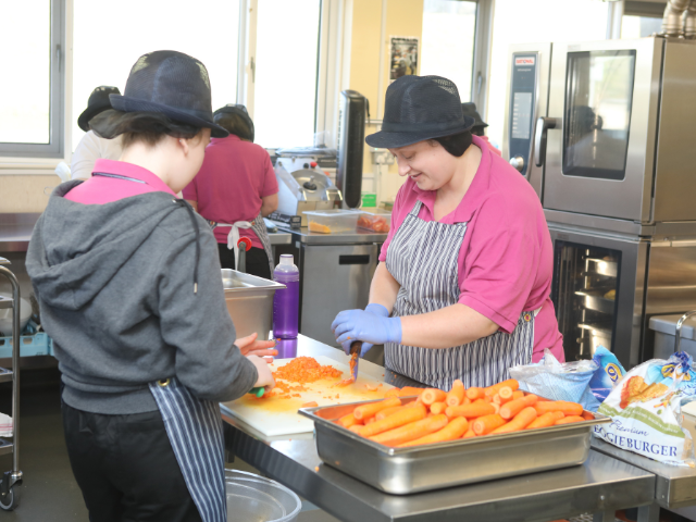 2 dinner ladies preparing food