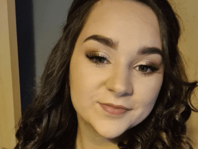 a lady smiling at the camera