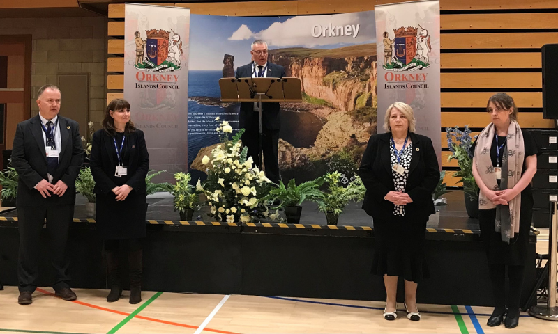 4 people standing in front of a stage