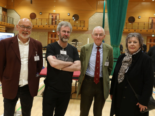 4 people standing at the voting centre