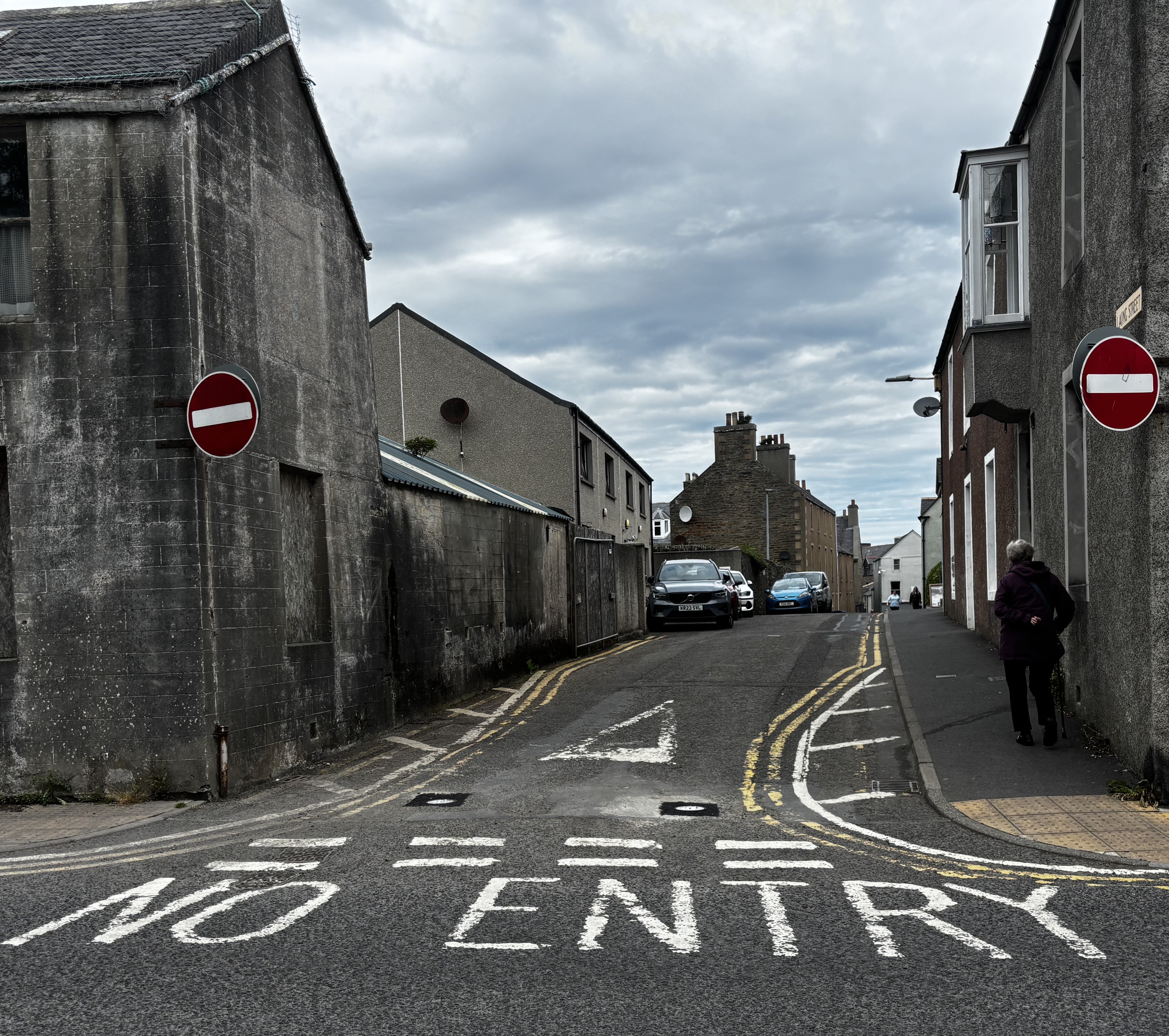 The words 'No Entry' written on the road