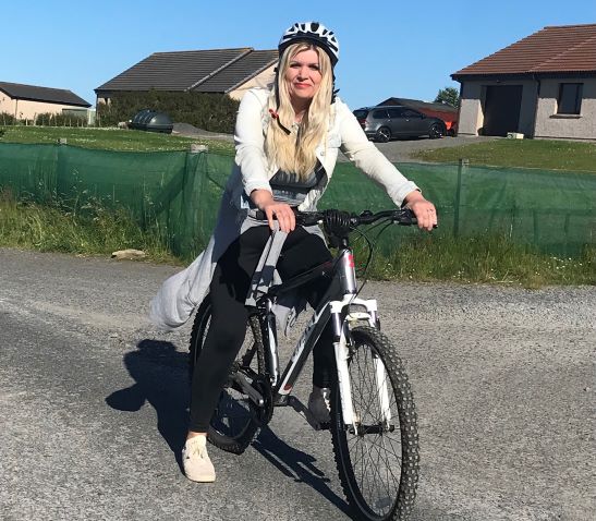 a lady on a bicycle