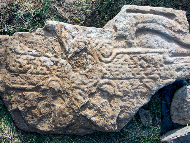 A stone with carvings in it