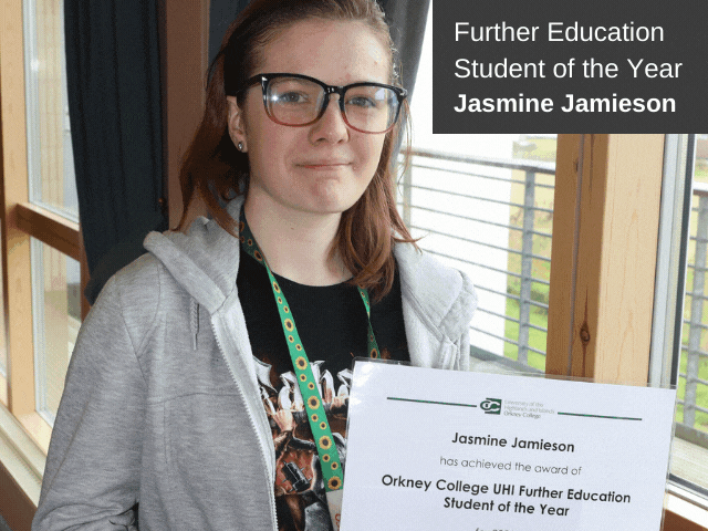 young girl holding certificate