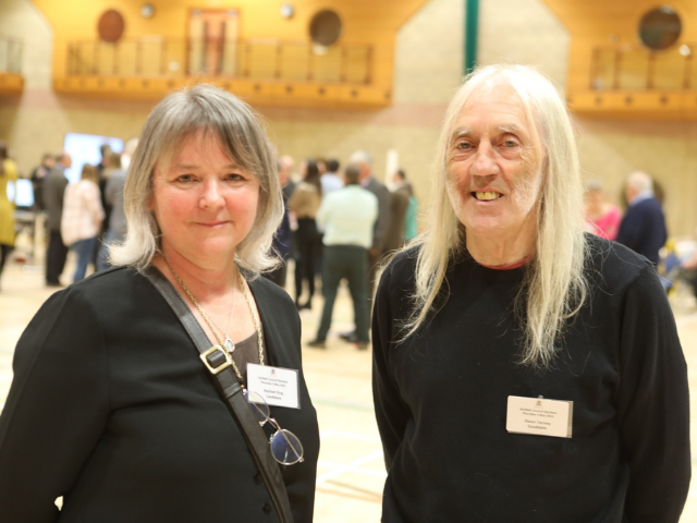 2 people smiling at the voting centre