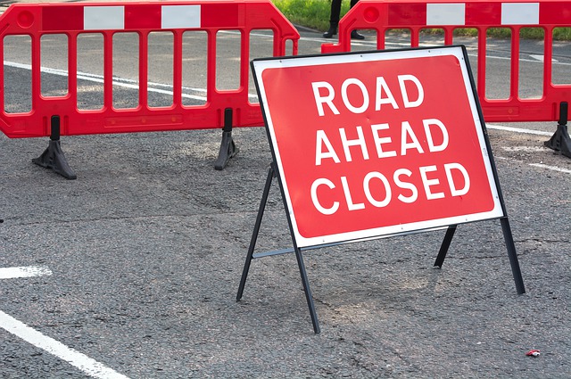 road ahead closed sign