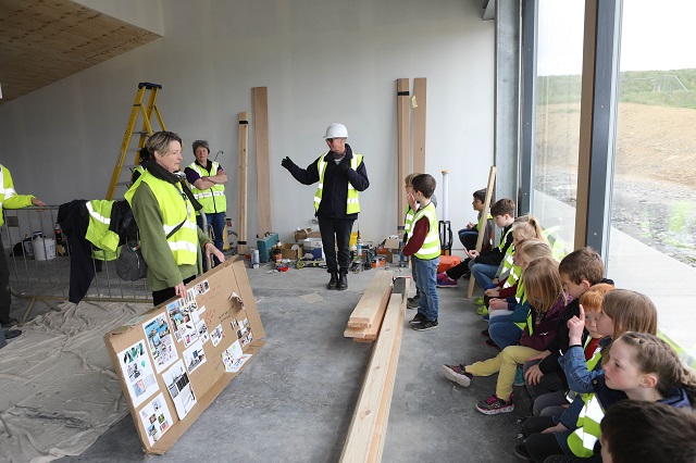 children and adults all in Hi-Vis being shown around Scapa Flow Museum