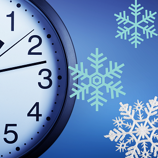 part of a clock with icicles in the background