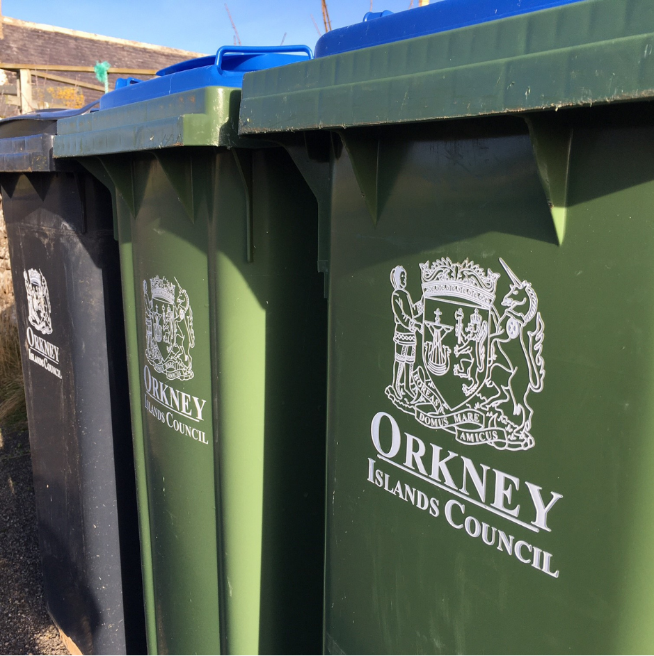 Three Wheelie Bins.